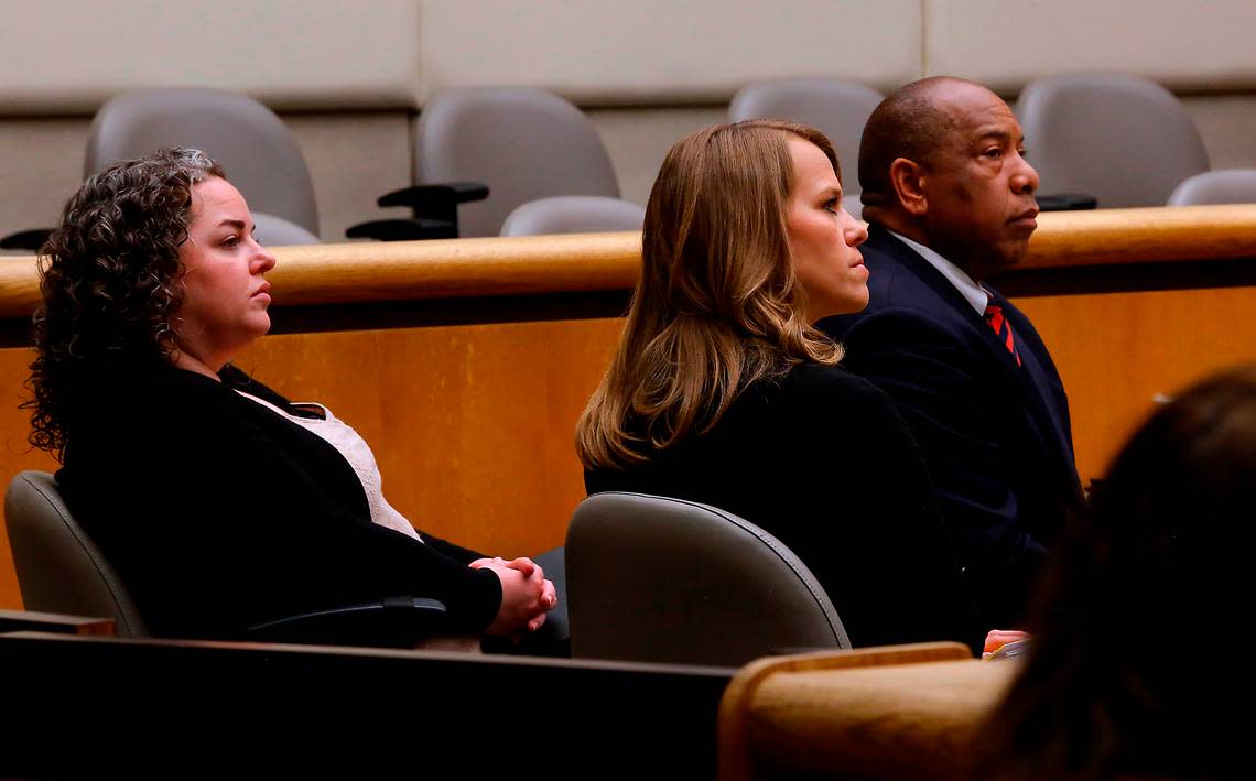 Richland School Board members Kari Williams, Audra Byrd and Semi Bird, from left, listen to arguments by both attorneys involved in the recall petition against them in Benton County Superior Court.