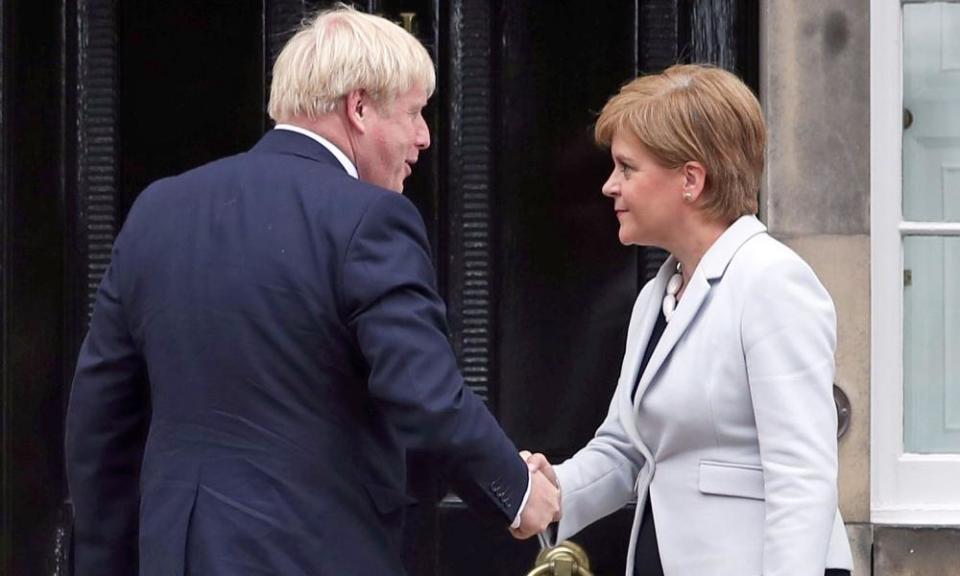 Boris Johnson and Nicola Sturgeon shake hands