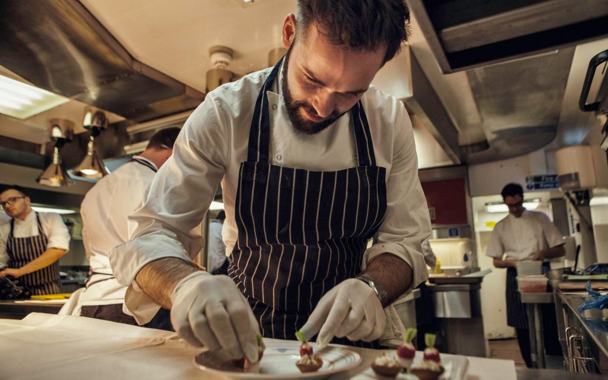 A chef prepares a dish during lunch service at the Gauthier Soho - Antonio Olmos /eyevine