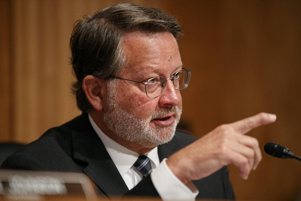 Senate Homeland Security and Governmental Affairs Committee Ranking Member Sen. Gary Peters., D-Mich., asks a question of Customs and Border Patrol Acting Commissioner Mark Morgan during a hearing on conditions at the southern border, Tuesday, July 30, 2019, on Capitol Hill in Washington. (AP Photo/Jacquelyn Martin)