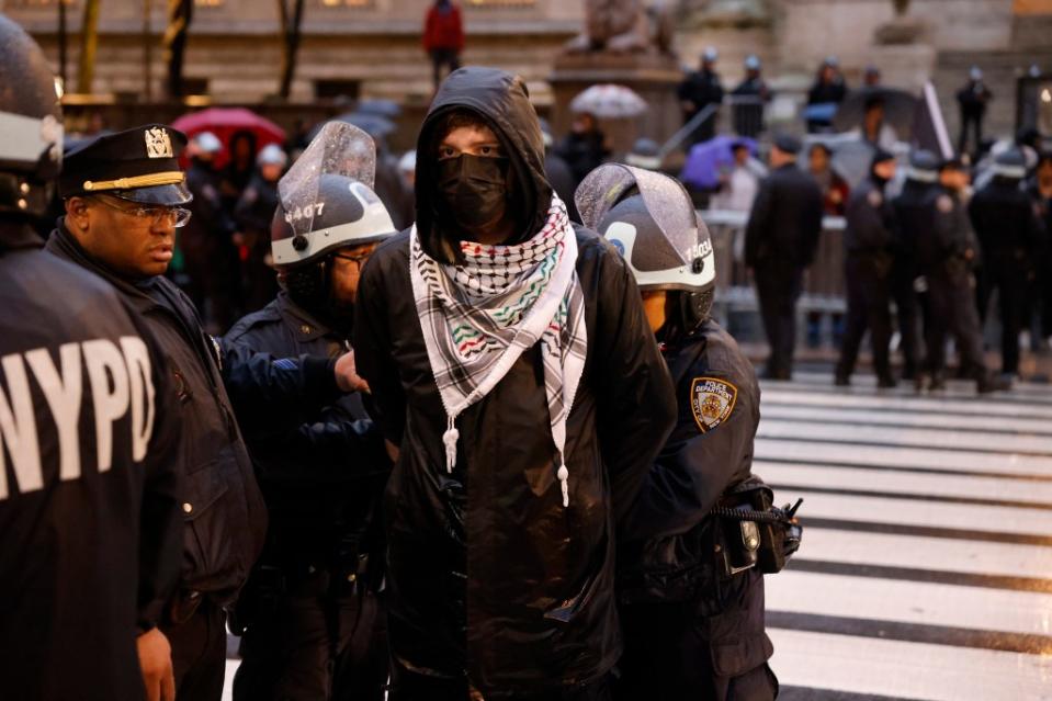 Pro-Palestine protests have rocked New York regularly since October 7, including in Manhattan on Saturday. As well as this masked demonstrator taken into custody outside New York Public Library, a group delayed the NYPD bomb squad. Kevin C. Downs for NY Post