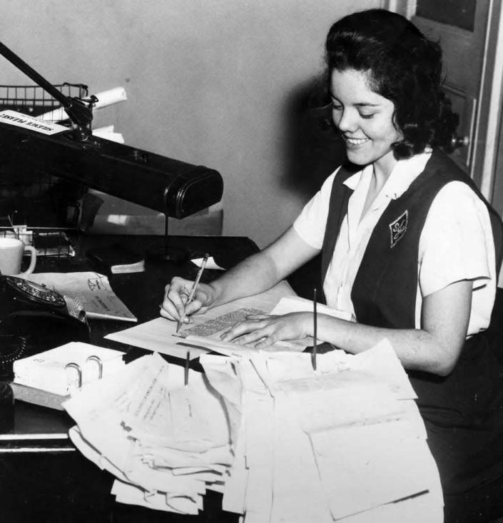 Margo Cox, now Pope, proofreads The Record as a paid intern during her senior year in high school.