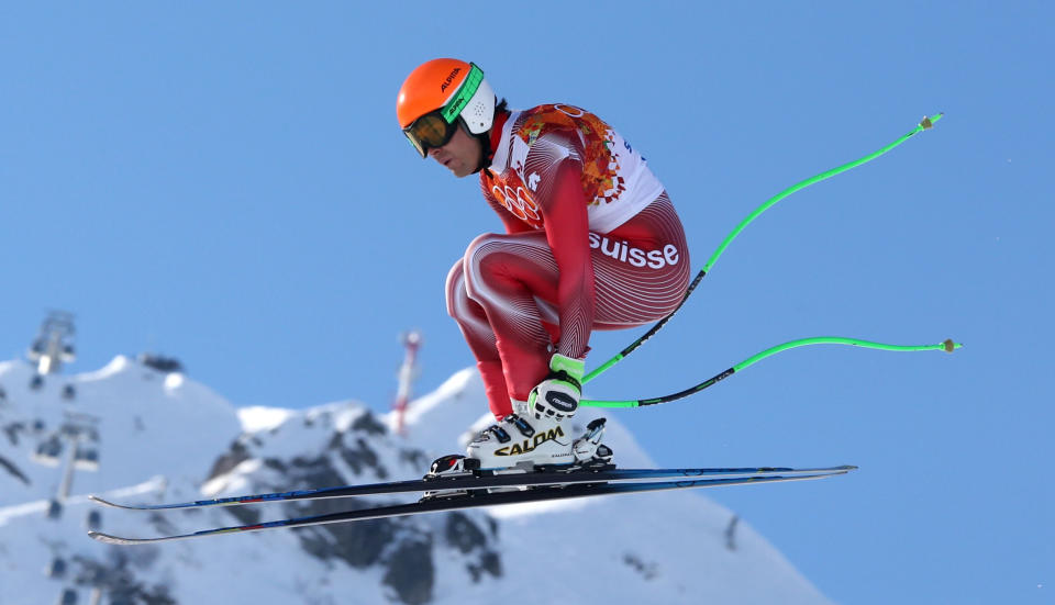 Switzerland's Sandro Viletta jumps during the downhill portion of the men's supercombined at the Sochi 2014 Winter Olympics, Friday, Feb. 14, 2014, in Krasnaya Polyana, Russia. (AP Photo/Luca Bruno)