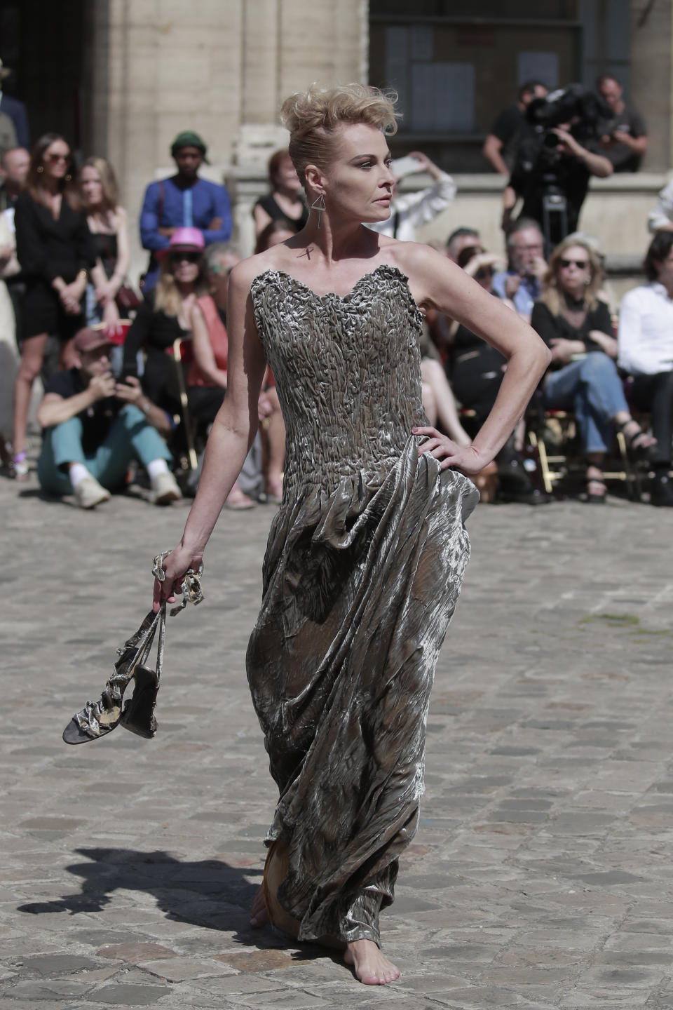 A model wears a creation for Franck Sorbier's Haute Couture Fall/Winter 2022-2023 fashion collection presented Wednesday, July 6, 2022 in Paris. (AP Photo/Lewis Joly)