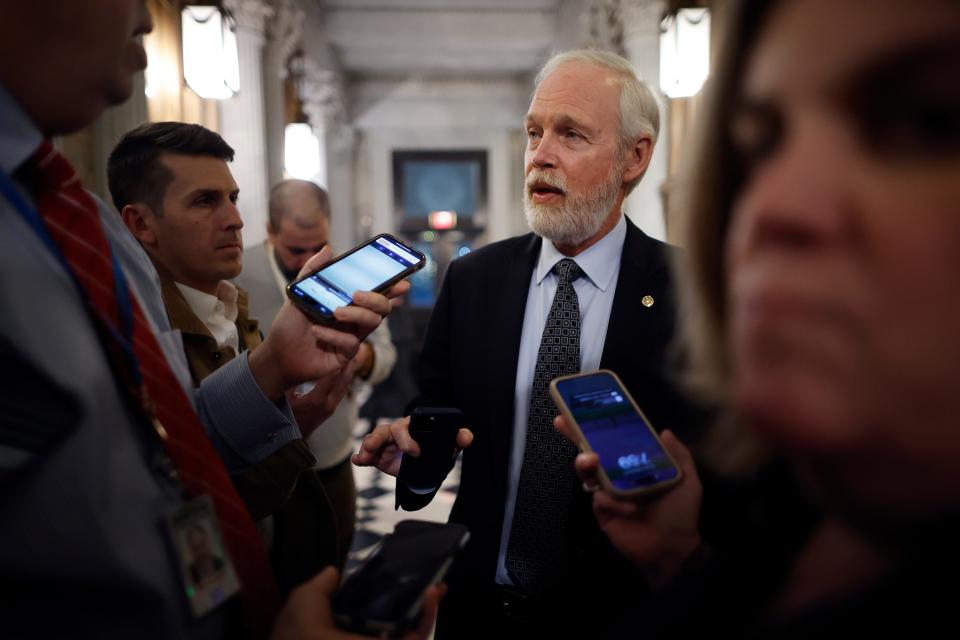 Sen. Ron Johnson, R-Wis., talks to reporters between votes at the U.S. Capitol on Feb. 12, 2024.