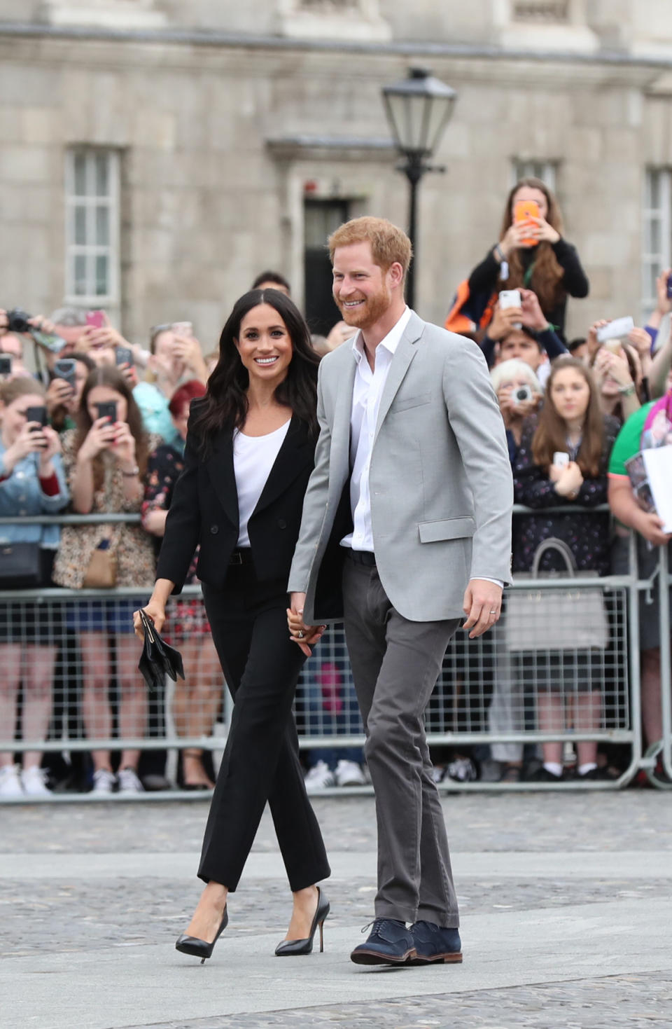 The Duchess of Sussex later changed into a slick two-piece suit by Givenchy and Sarah Flint heels [Photo: PA]