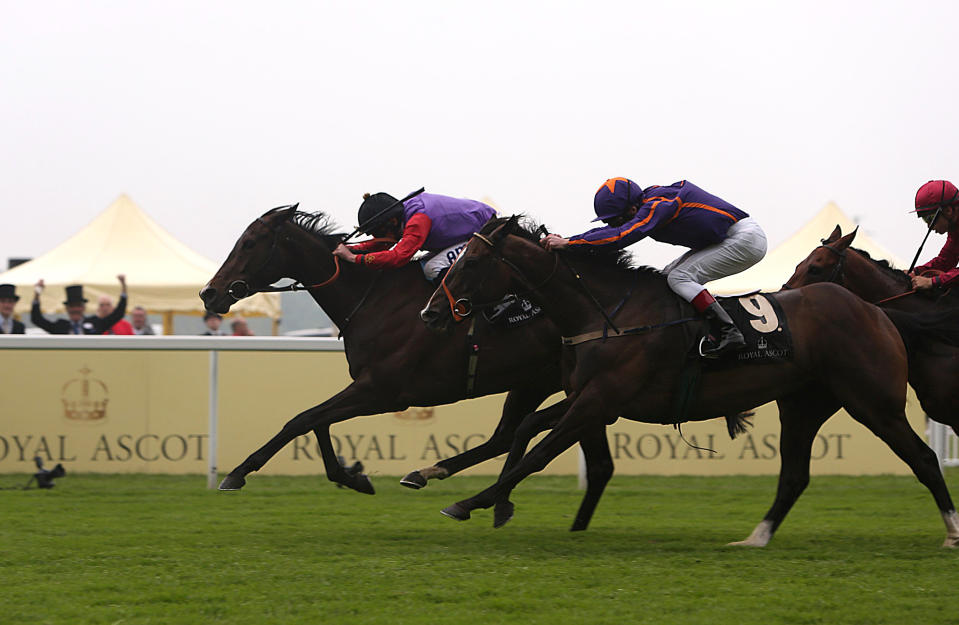 Estimate ridden by jockey Ryan Moore wins the Gold Cup ahead of Simenon ridden by jockey Johnny Murtagh, center, on day three of the Royal Ascot horse race meeting in Ascot, England, Thursday, June 20, 2013. (AP Photo/PA, Steve Parsons) UNITED KINGDOM OUT NO SALES NO ARCHIVE