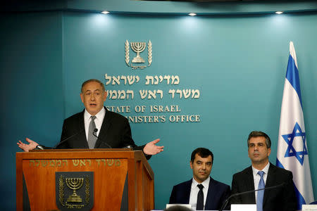 FILE PHOTO: Israeli Prime Minister Benjamin Netanyahu speaks during a news conference with Mobileye founder Amnon Shashua (C) and and Israel's Minister of the Economy Eli Cohen in Jerusalem March 14, 2017. REUTERS/Ronen Zvulun/File Photo