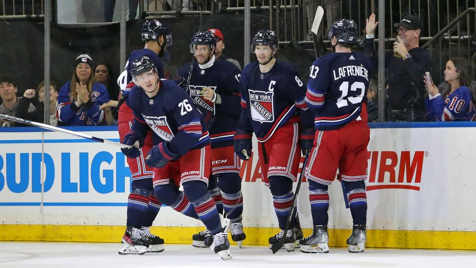 Dec 10, 2023; New York, New York, USA; New York Rangers left wing Jimmy Vesey (26) celebrates his goal with center Nick Bonino (12), forward Alexis Lafreniere (13), defenseman K'Andre Miller (79) and defenseman Jacob Trouba (8) during the second period against the Los Angeles Kings at Madison Square Garden. Mandatory Credit: Danny Wild-USA TODAY Sports