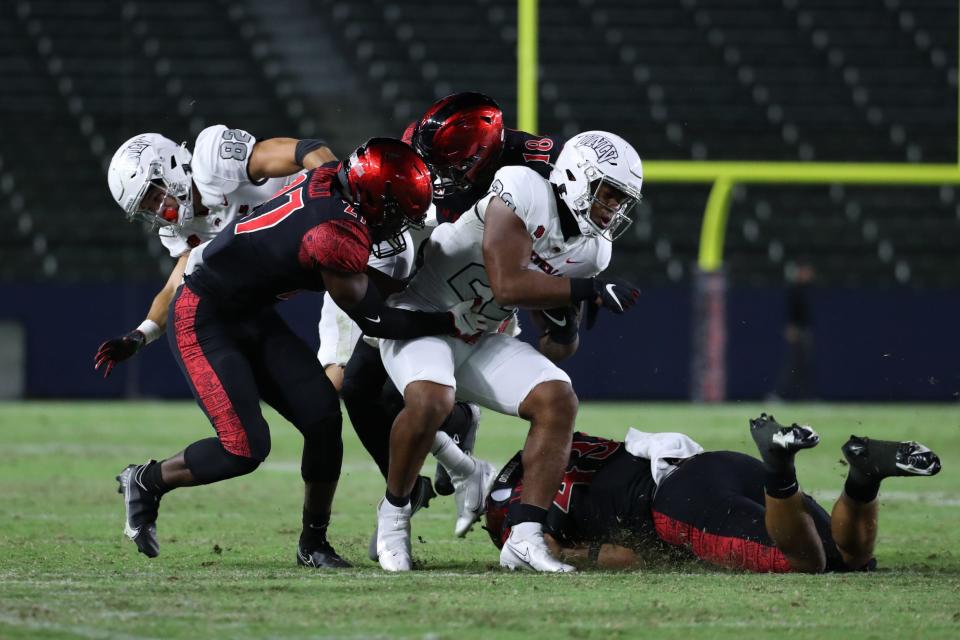 San Diego State defensive back Cedarious Barfield makes a tackle against UNLV on Saturday, Oct. 24. Barfield graduated from El Dorado High School and is a key contributor for SDSU.