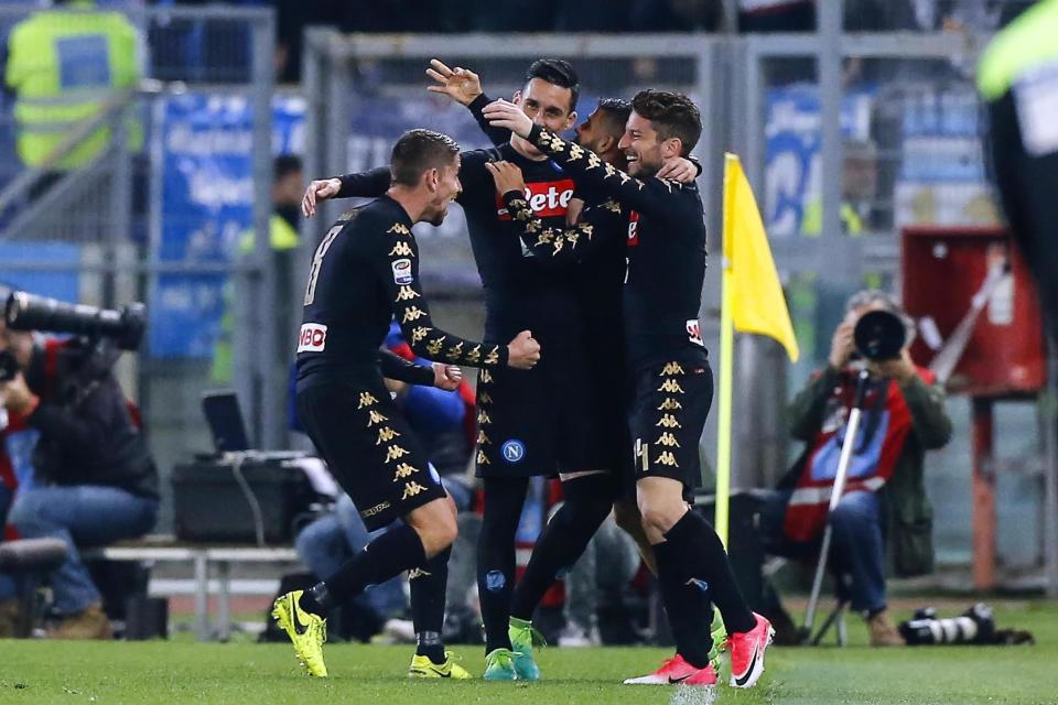 Napoli's' Lorenzo Insigne, right, celebrates with teammates after scoring a goal during the Italian Serie A soccer match between Lazio and Napoli at the Olympic stadium in Rome, Italy, Sunday, April 9, 2017. (Angelo Carconi/ANSA via AP)