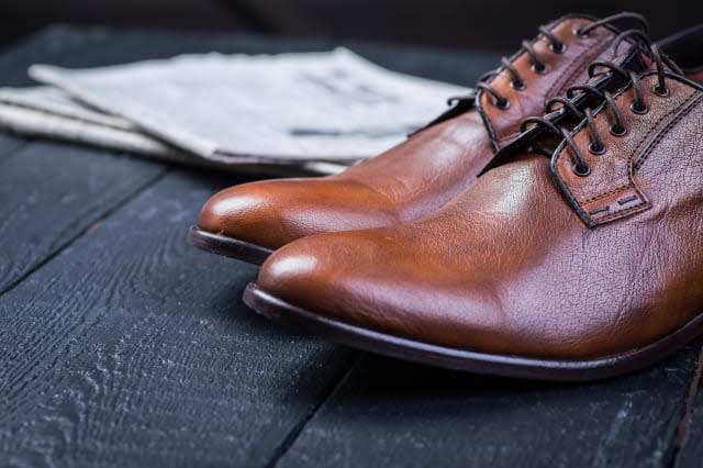 a pair of brown leather shoes...