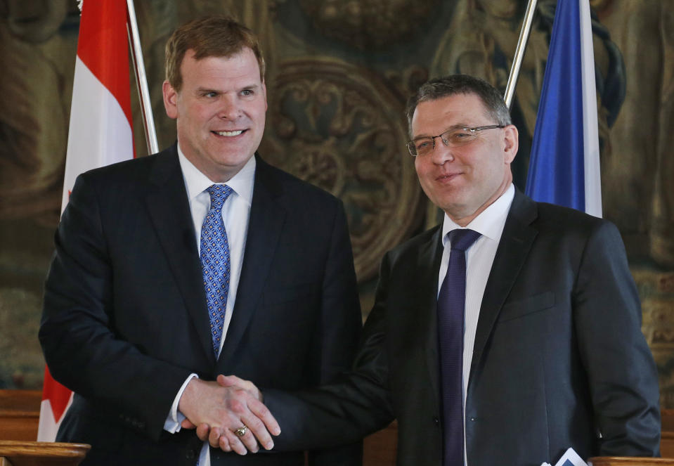 Canadian Foreign Affairs Minister John Baird, left, shakes hand with his Czech Republic's counterpart Lubomir Zaoralek, right, after their joint press conference in Prague, Czech Republic, Tuesday, April 22, 2014. (AP Photo/Petr David Josek)