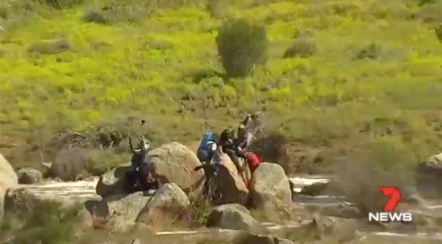 The Shepherd family were stranded on rocks. Source: 7News