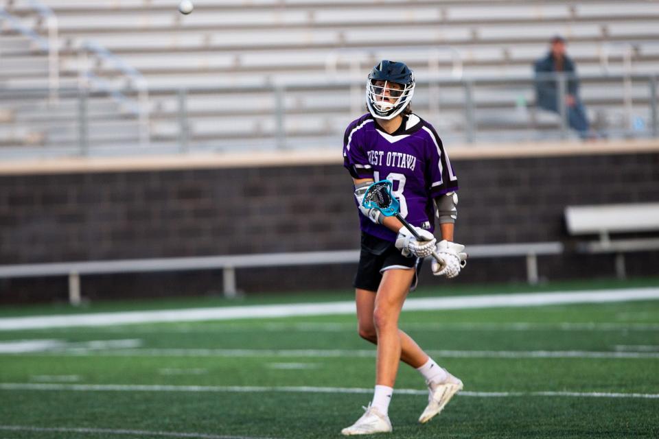 West Ottawa's Eli Armstrong passes to a teammate during a game against Zeeland Thursday, May 4, 2023 at West Ottawa High School. 