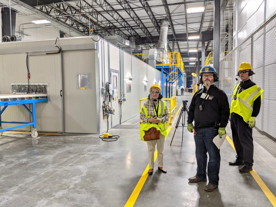 Linda Spence of the Washington County Business Development Department tours the new, $70 million IKO manufacturing facility off Western Maryland Parkway on Thursday. In the center is the tour leader, Jared Foster, who is the plant's maintenance planner. At right is Derek Fee, manager of corporate communications for the IKO group of companies.