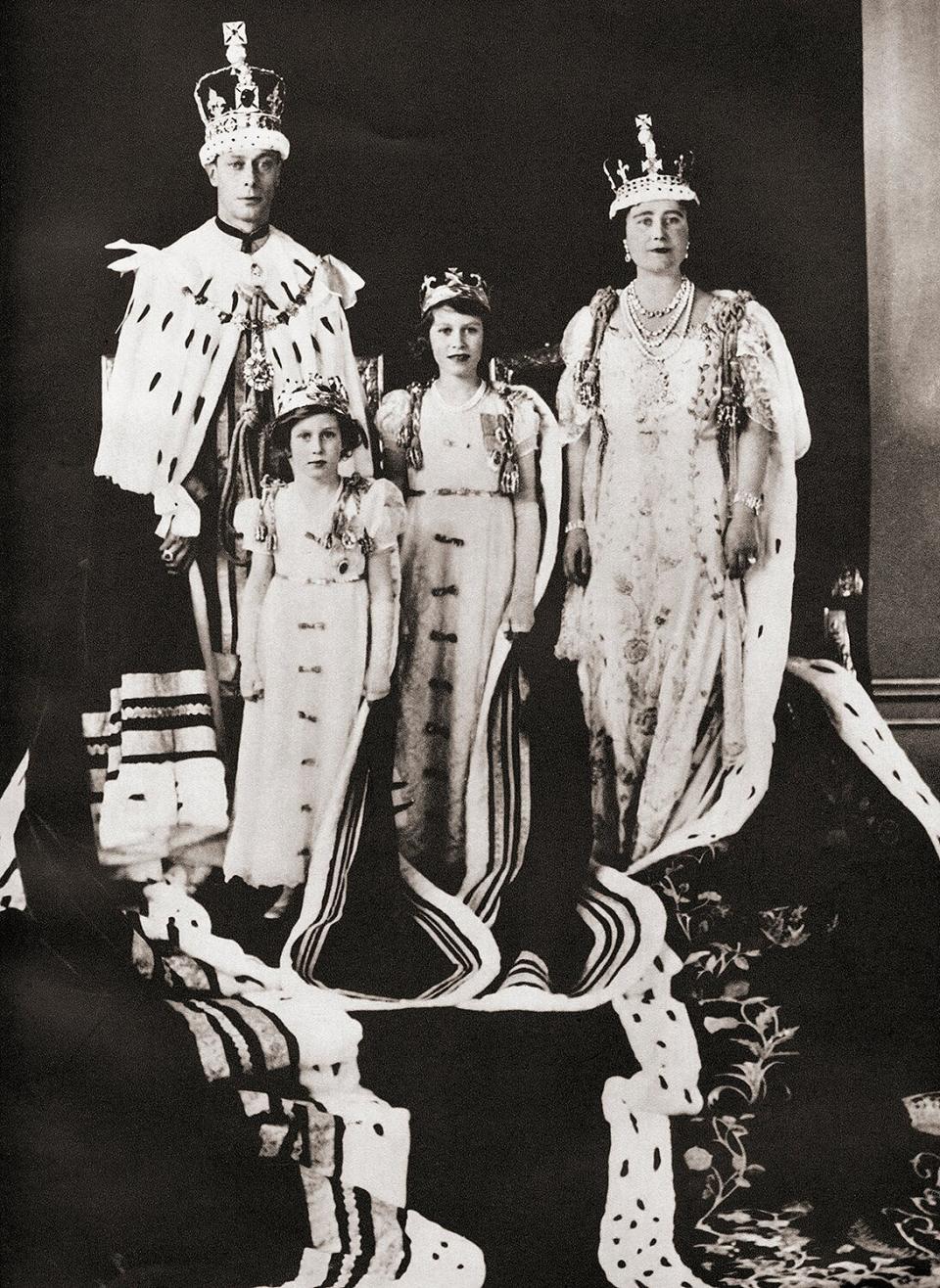 King George VI and his wife Queen Elizabeth seen here the day of their coronation, 12 May, 1937, with their daughters Princess Margaret and Princess Elizabeth, future Queen Elizabeth II.