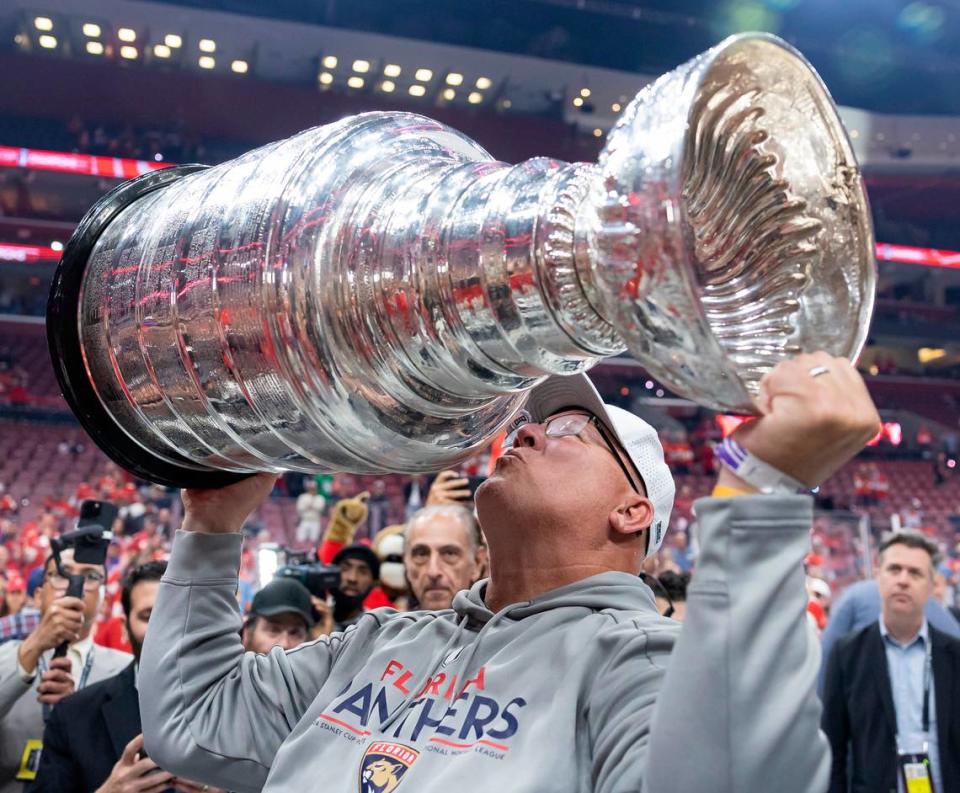 Florida Panthers left wing Matthew Tkachuk’s father Keith Tkachuk kisses the Stanley Cup after the Panthers defeated the Edmonton Oilers.