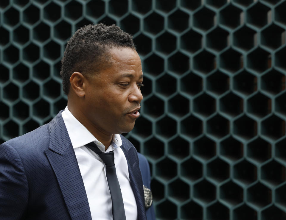 Actor Cuba Gooding Jr., left, is lead by a police officer from New York's Special Victim's Unit, Thursday, June 13, 2019. He faces allegations he groped a woman at a city night spot. A 29-year-old woman told police the 51-year-old Gooding grabbed her breast while he was intoxicated around 11:15 p.m. Sunday. Gooding denies the allegations. (AP Photo/Mark Lennihan)