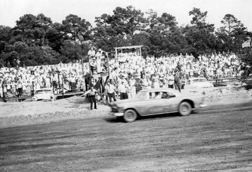 Richard Brickhouse, 1969 Talladega 500 winner, flashing past the grandstands at the Carolina Beach Speedway, 1964.