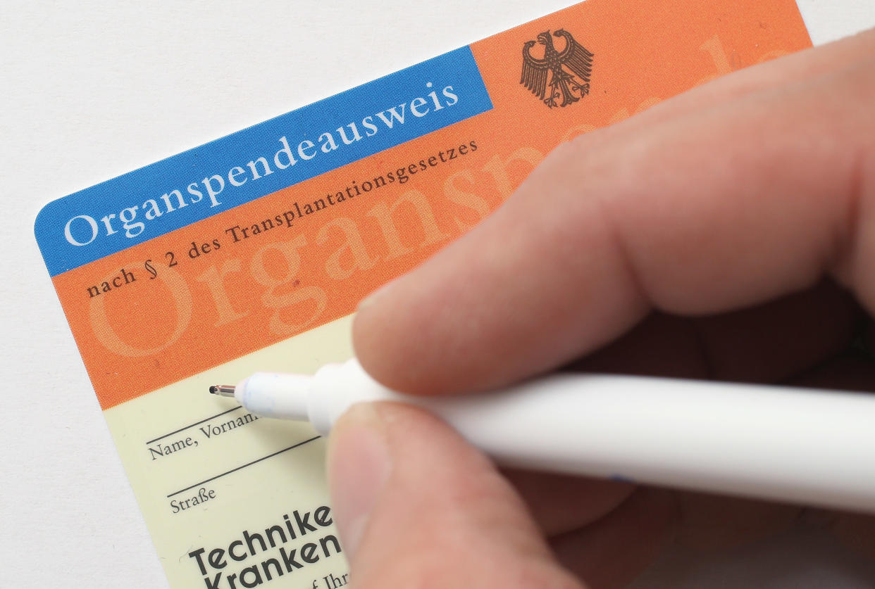 BERLIN, GERMANY - NOVEMBER 13:  In this photo illustration a real organ donor's card (Organspendeausweis) from public health insurer Techniker Krankenkasse is seen on November 13, 2012 in Berlin, Germany. German health insurance companies are sending out the cards to their policy holders in an effort to get more people registered for organ donation. Demand for organs in Germany is high and waiting lists are long.  (Photo Illustration by Sean Gallup/Getty Images)