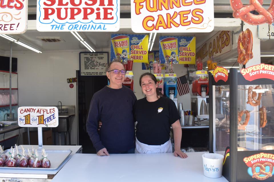 Mary Poudel and Danny King, owners of King's Cotton Candy, welcome customers on the Boardwalk at 422 S Atlantic Ave. on Tuesday, October 3, 2023, in Ocean City, Maryland.