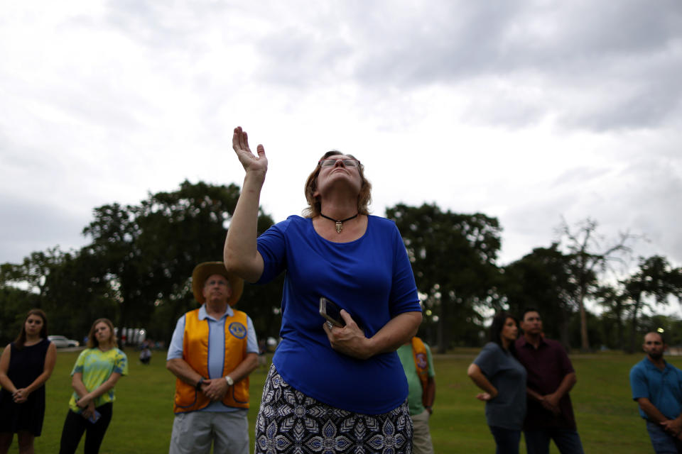 <p>A mourner prays during a vigil in memory of the victims killed in a shooting at Santa Fe High School in League City, Texas, May 20, 2018. (Photo: Jonathan Bachman/Reuters) </p>