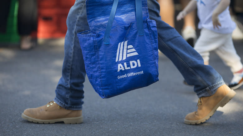 Aldi customer with shopping bag