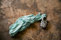 A child's shoe and a dress lay inside the Orphanage of the Church of Bible Understanding where a fire broke out the previous night in Kenscoff, on the outskirts of Port-au-Prince, Haiti, Friday, Feb. 14, 2020. A fire swept through this orphanage run by a Pennsylvania-based nonprofit group, killing over a dozen children, according to health care workers. (AP Photo/Dieu Nalio Chery)