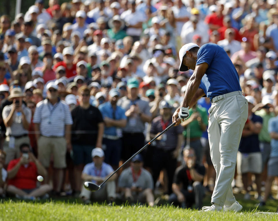 Tiger Woods tees off on the 17th hole during the third round of the PGA Championship golf tournament at Bellerive Country Club, Saturday, Aug. 11, 2018, in St. Louis. (AP Photo/Charlie Riedel)