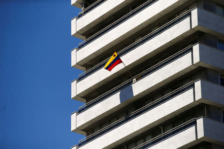 A Venezuelan flag flies on a balcony of the Venezuelan embassy in Madrid, Spain, May 15, 2018. REUTERS/Javier Barbancho