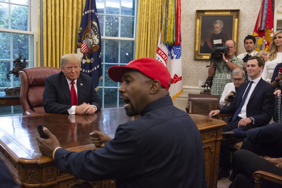 President Donald Trump meets with rapper Kanye West in the Oval Office of the White House in Washington D.C. on October 11, 2018. (Photo by Calla Kessler/The Washington Post via Getty Images)