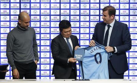 Britain Football Soccer - Manchester City announce sleeve partnership - City Football Academy - 17/3/17 Manchester City manager Pep Guardiola, Nexen Tire CEO Travis Kang and chief executive Ferran Soriano during the announcement of a partnership with Nexen Tire Action Images via Reuters / Ed Sykes