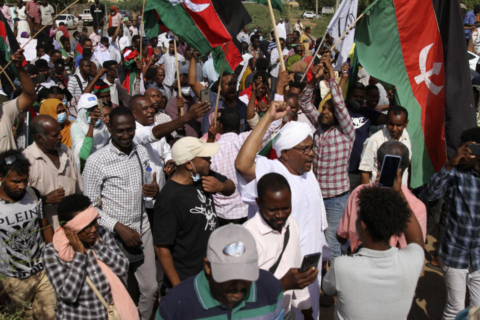 Sudanese participate in a demonstration, in Khartoum, Sudan, Thursday, Sept. 30, 2021. Thousands of Sudanese rallied in the capital of Khartoum against the country's military and demanding the formation of new transitional authorities that would exclusively consist of civilians. Thursday's demonstration accused the generals of derailing the country’s transition to democracy. (AP Photo/Marwan Ali)