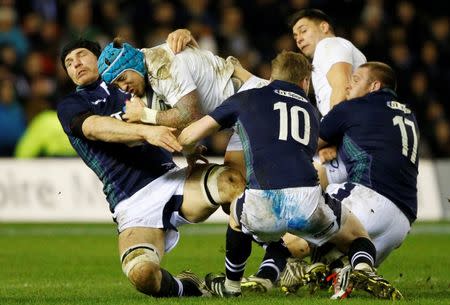 Rugby Union - Scotland v England - RBS Six Nations Championship 2016 - Murrayfield Stadium, Edinburgh, Scotland - 6/2/16 England’s Jack Nowell tackled by Scotland’s Tim Swinson Reuters / Russell Cheyne Livepic