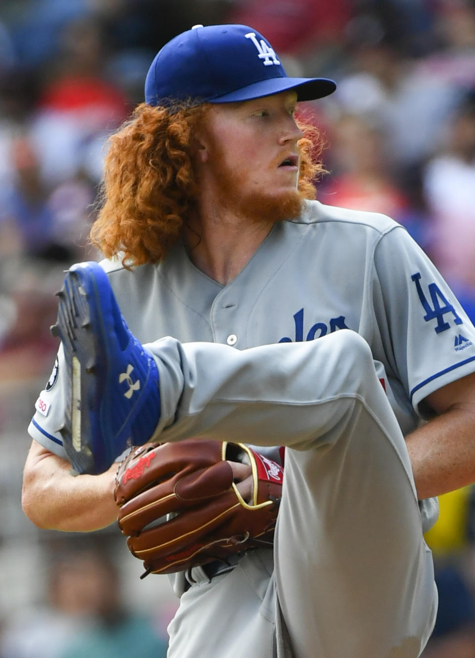 Los Angeles Dodgers pitcher Dustin May winds up during the sixth inning of a baseball game against the Atlanta Braves, Sunday, Aug. 18, 2019, in Atlanta. (AP Photo/John Amis)