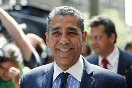 Senator Adriano Espaillat (C) exits a voting center after voting in the Democratic Primary election in New York June 24, 2014. REUTERS/Eduardo Munoz