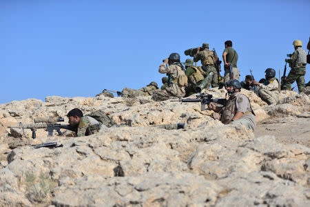 Popular Mobilization Forces (PMF) take part in an operation against Islamic State militants on the outskirts of the town of Hammam Al-Alil in the south of Mosul, Iraq October 30, 2016. REUTERS/Stringer