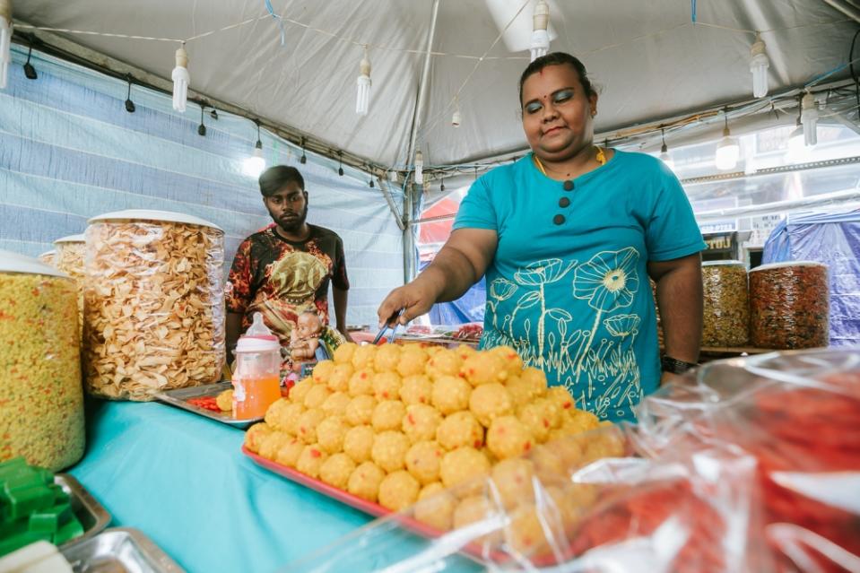 Giovannia Thanggayah, 32, sells homemade murukku and other traditional delicacies at Jalan Tengku Kelana with her husband.  
