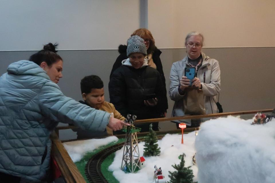 Visitors check out the “Hayes Train Special,” which opens Nov. 24 for the holiday season.