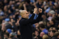 Manchester City's head coach Pep Guardiola celebrates after Manchester City's Phil Foden scores his side's second goal during an English Premier League soccer match between Manchester City and Manchester United at the Etihad Stadium in Manchester, England, Sunday, March 3, 2024. (AP Photo/Dave Thompson)