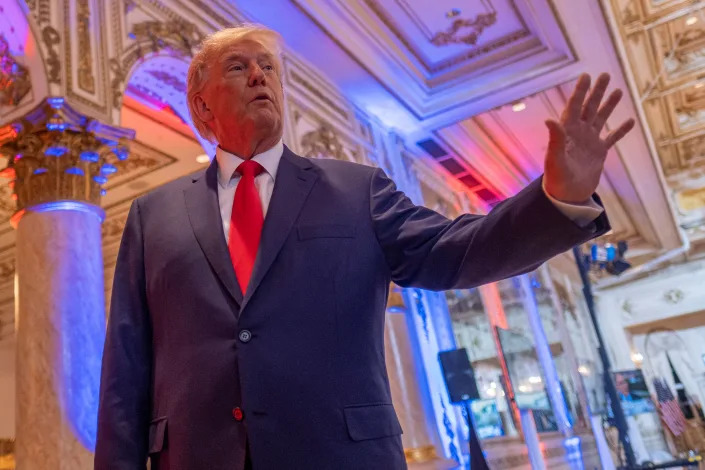 Former President Donald Trump talks to the press at his Mar-a-Lago resort on midterm elections night in Palm Beach, Fla.