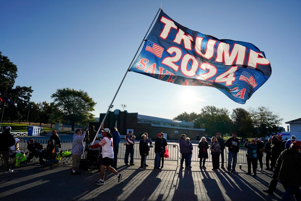 Supporters wait to enter a former President Donald Trump commit to caucus rally, Saturday, Oct. 7, 2023, in Waterloo, Iowa. (AP Photo/Charlie Neibergall)