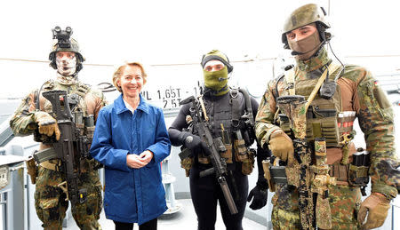 German Defense Minister Ursula von der Leyen and combat divers of German special naval forces pose for media during her visit at the German army "Bundeswehr" in Kiel, Germany April 21, 2017. REUTERS/Fabian Bimmer