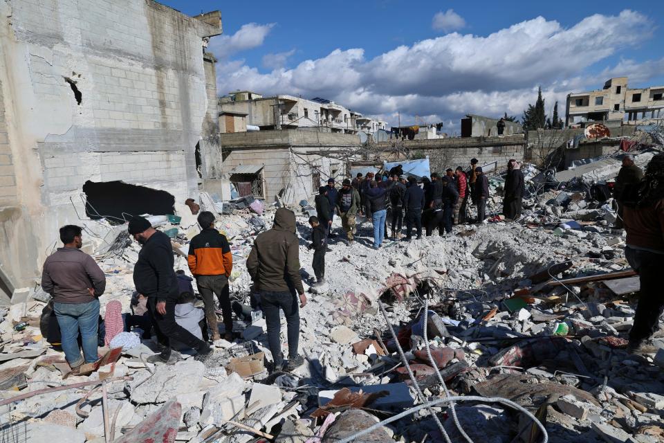 People search through the rubble of collapsed buildings in the town of Jinderis, Aleppo province, Syria on Tuesday. Knoxville business owner and Syrian refugee Yassin Terou has partnered with Syria Relief & Development to provide meals to those in Turkey and Syria.