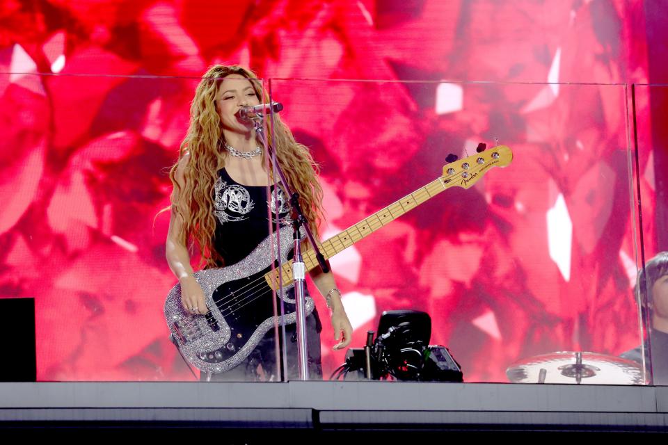 Shakira rocks out on guitar for a performance of "Cómo Dónde y Cuándo" during her pop-up show in Times Square, New York City, on March 26, 2024.