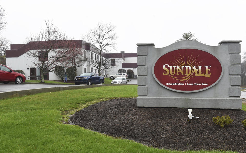 FILE - In this March 25, 2020, file photo, a Sundale nursing home sign sits on the property in Morgantown, W.Va., where several people have tested positive for the coronavirus. Nursing homes across the country went into lockdown this month with mandatory measures to protect their frail, elderly residents from coronavirus, but an alarming wave of deadly outbreaks nearly every day since suggests the steps that included a ban on visits and daily health screenings of staffers either came too late or were not rigorous enough. (Ron Rittenhouse/Dominion Post via AP, File)