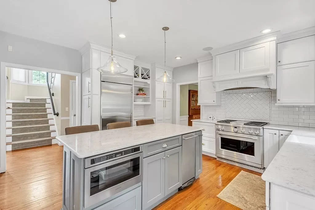 This home at 380 Mohawk Road in Raynham that sold for $949,000, on Sept. 29, 2023, has a kitchen that opens to an oversized, multi-tiered deck that leads to the private backyard and patio.