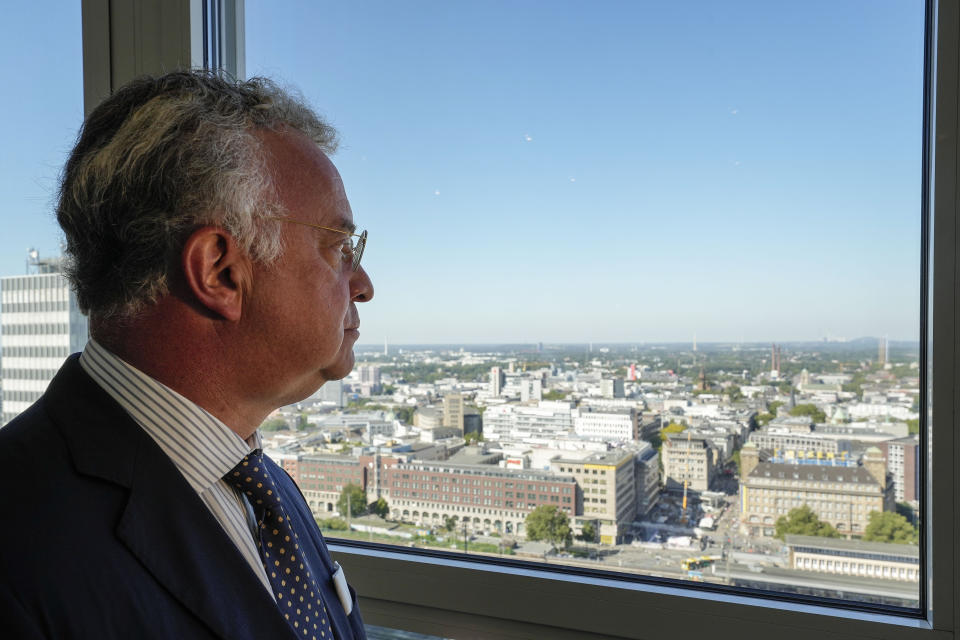 CEO Christian Kullmann of German specialty chemicals company Evonik Industries looks to the Essen city center after an interview in his office at the headquarters in Essen, Germany, Thursday, Sept. 7, 2023. (AP Photo/Martin Meissner)