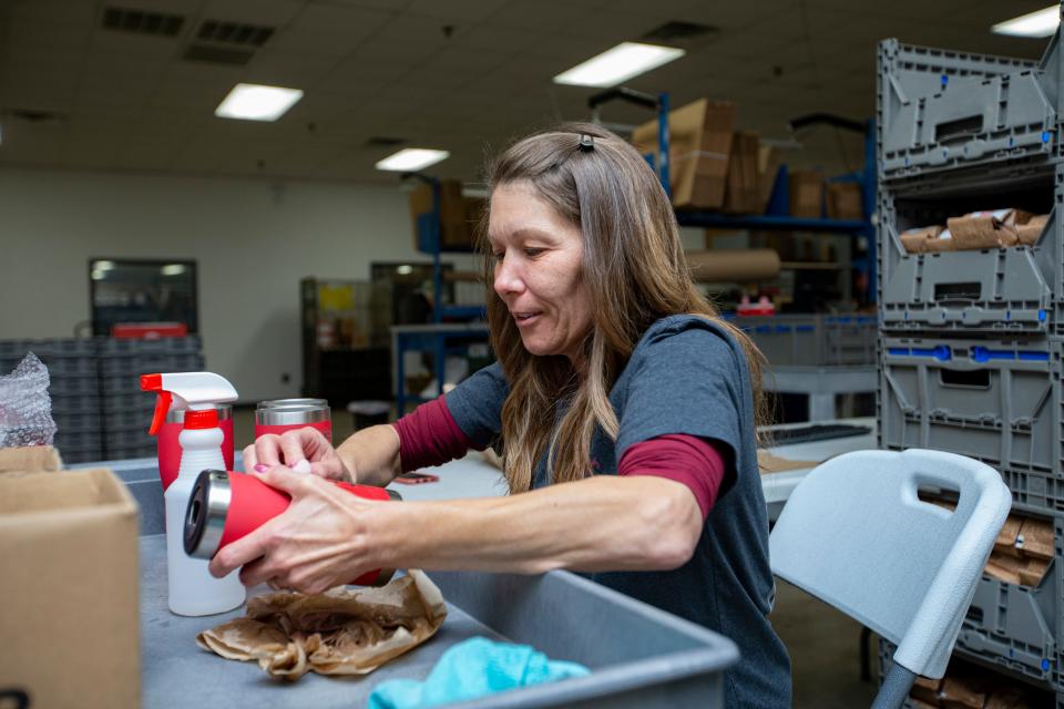 Dawn Campbell cleans coffee mugs on Wednesday, Nov. 16, 2022, at Fire Dept. Coffee in Rockford.